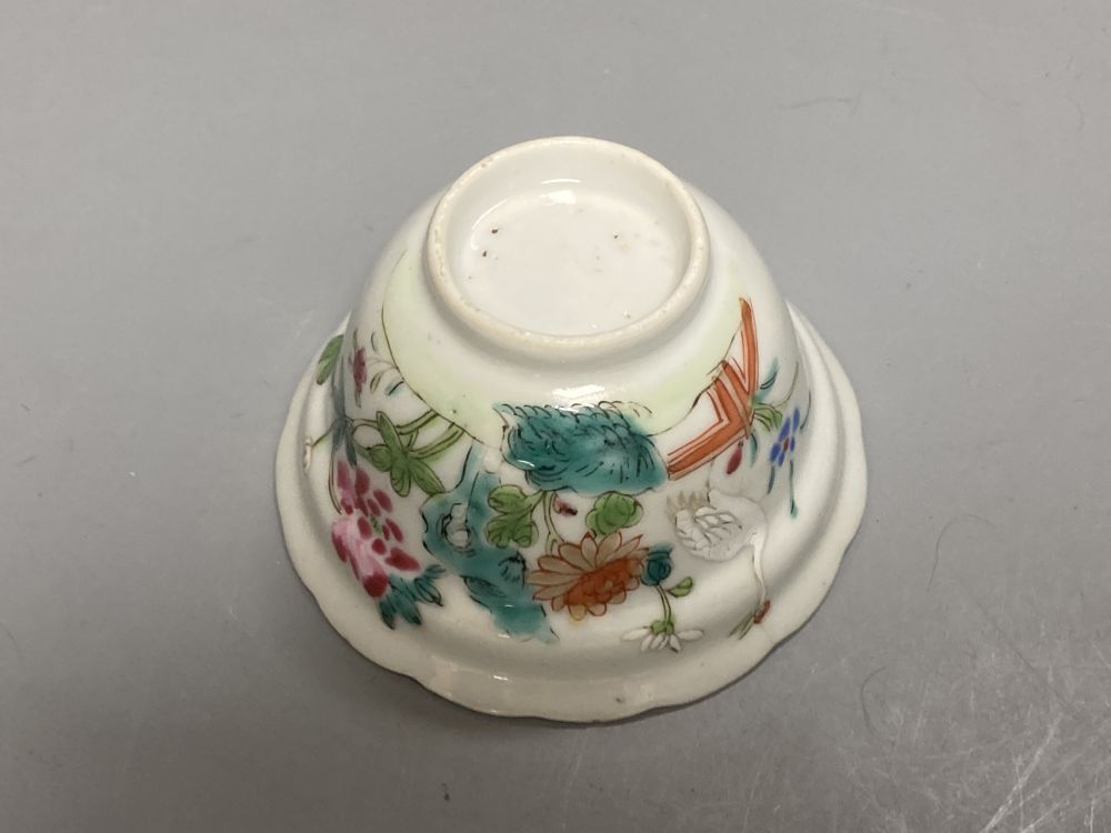 An 18th century English blue and white tea bowl and three smaller Chinese ceramic cups, two marks